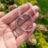 Oak-twig-heart-necklace-hand-background