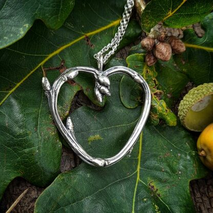 Oak-twig-heart-necklace-natural-background-1