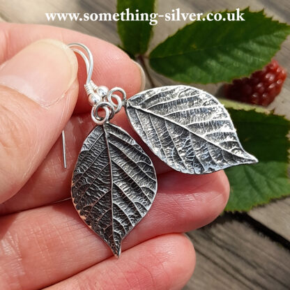 sterling silver Bramble leaf drop earring in hand