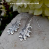 Sterling Silver oak leaf drop earrings with natural background